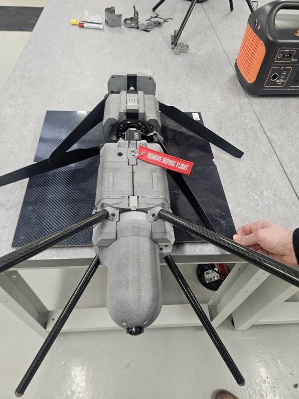 Defence UAV payload full assembly top view with Remove Before Flight tag