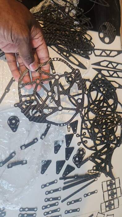 CNC waterjet-cut carbon fibre and machined aluminium structural components