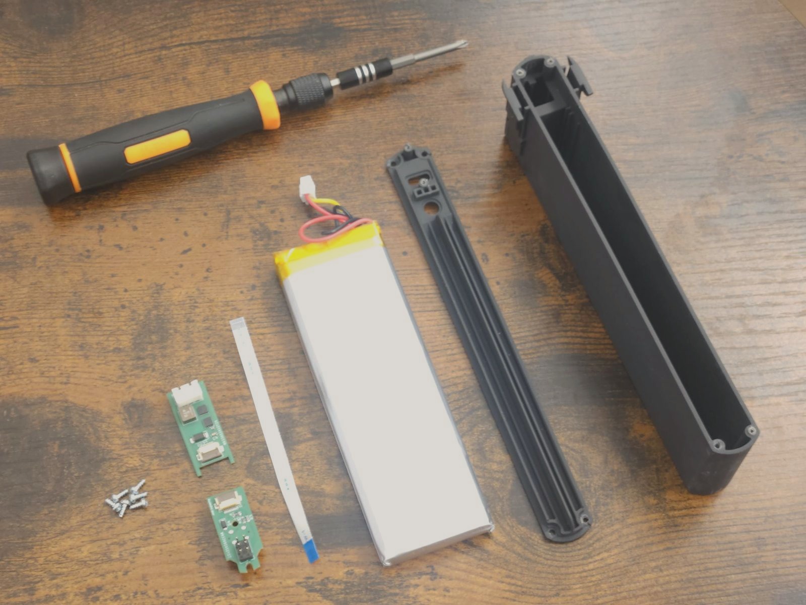 Exploded view of the battery, charge board, interface board, FFC and extruded housing